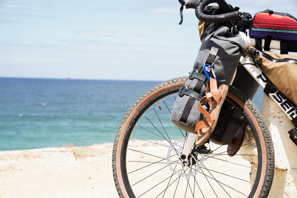 Buoy Bags in Grey Cordura at the beach on a gravel bike