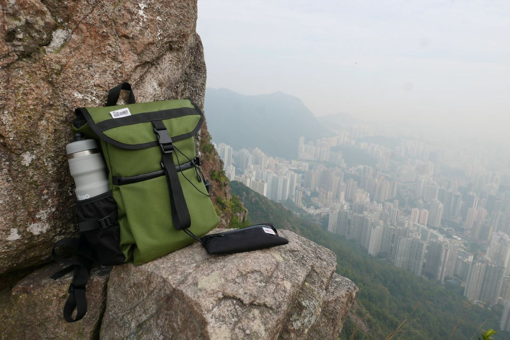 Slacker Backpack in Olive Above the Hong Kong City